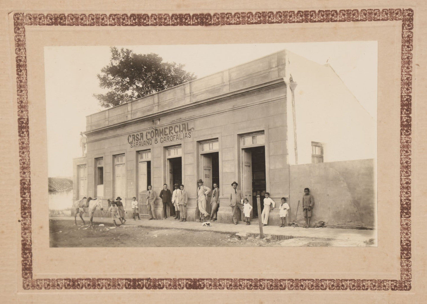 Lot 070 - Antique Mexican Or South American Boarded Photograph Of A General Store Or Like Establishment, Casa Comercial, Sarapiqui & Garofalías, With Two Dogs In Photo