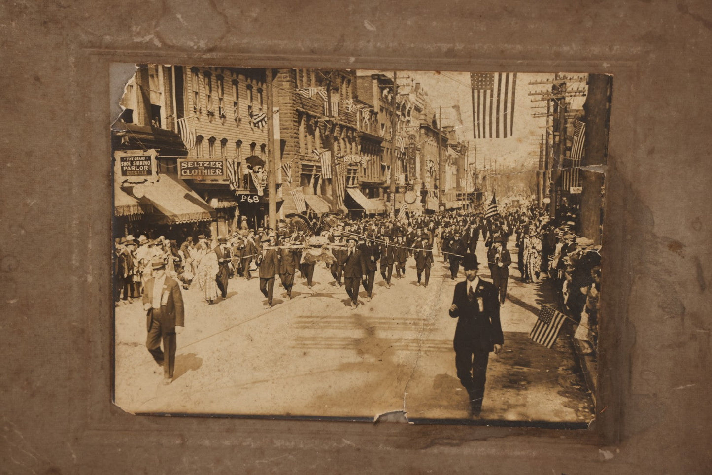 Lot 074 - Antique Boarded Parade Photo On Urban Street With Many 48-Star American Flags, Possible Celebration Of The End Of World War One, Or Other Patriotic Event, Note Loss To Corner, Wear, Harpel Photographer, Lebanon, Pennsylvania