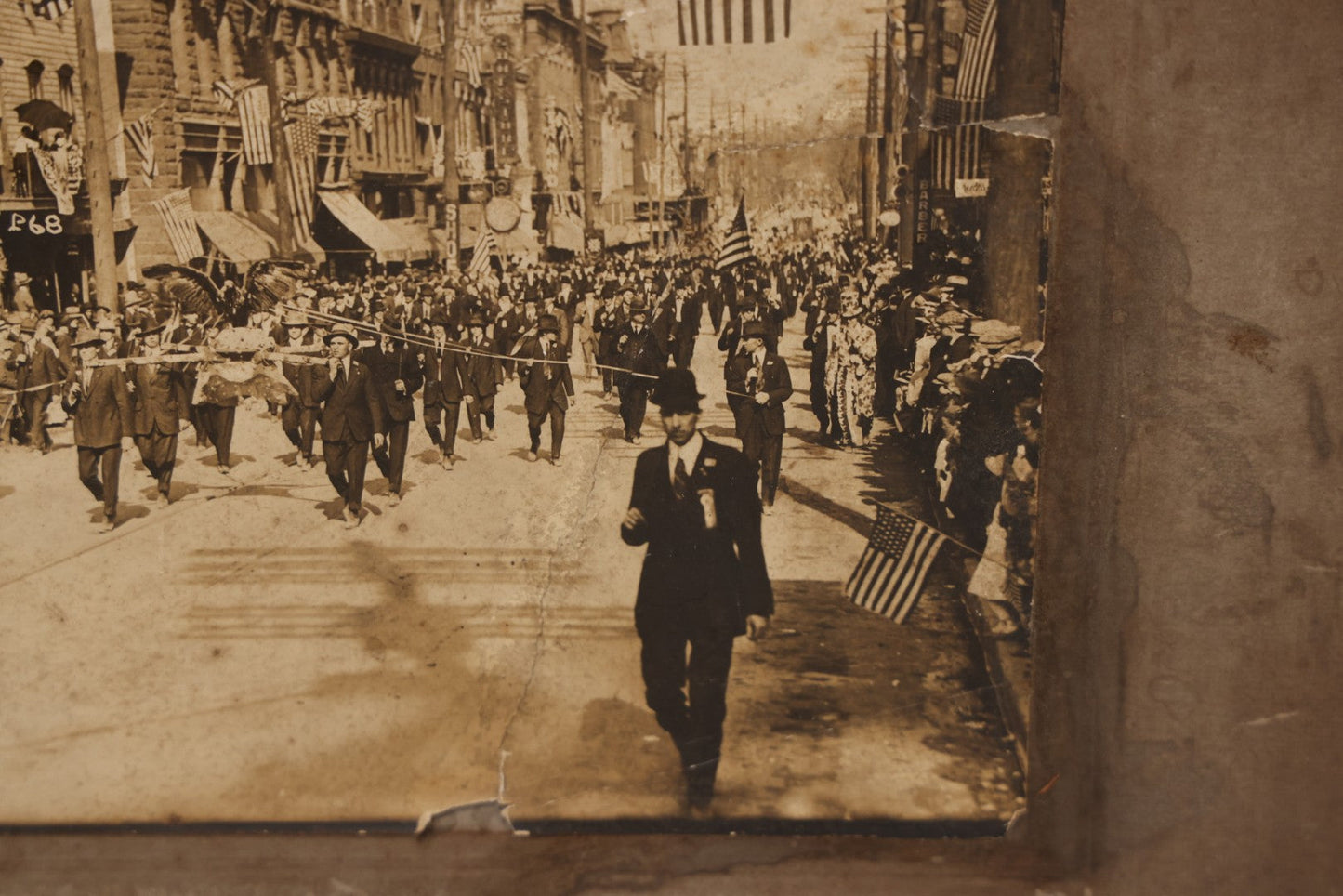 Lot 074 - Antique Boarded Parade Photo On Urban Street With Many 48-Star American Flags, Possible Celebration Of The End Of World War One, Or Other Patriotic Event, Note Loss To Corner, Wear, Harpel Photographer, Lebanon, Pennsylvania