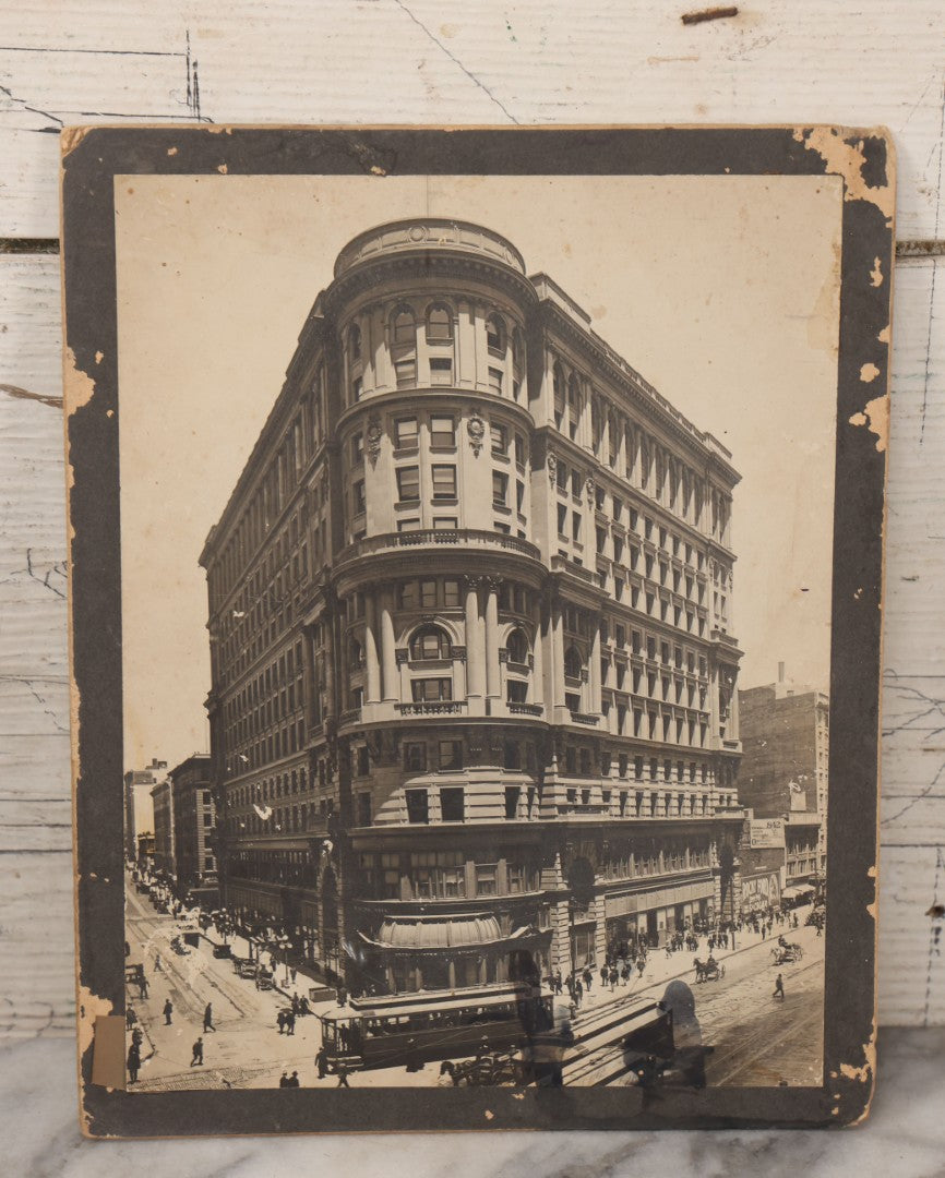 Lot 075 - Antique Boarded Photograph Of The Flood Building, San Francisco, California, Circa 1900, With Trolley Car In Photo, United States Depository, Note Wear, Handwriting On Verso