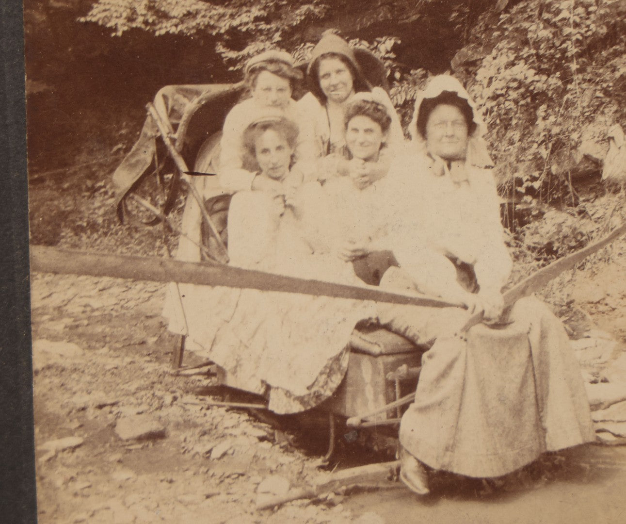 Lot 077 - Antique Boarded Photo Of Five Women In Makeshift Fanciful Flying Machine, Sleigh, Mother Hubbard Dress-Up, Little Boy In Background