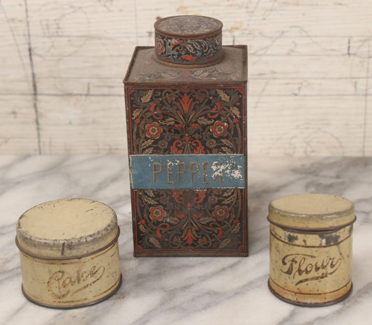 Lot 094 - Three Piece Vintage And Antique Tin Lot Including J.S. Fry And Co. Coca Tin-Turned-Pepper-Tin, Cake Tin, And Flour Tin