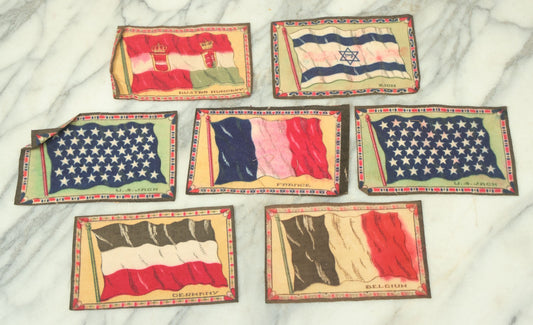 Lot 141 - Grouping Of Seven Antique Tobacco Felt Country Flags Including The United States Jack, France, Austria Hungary, Zion, Belgium, Germany, And France