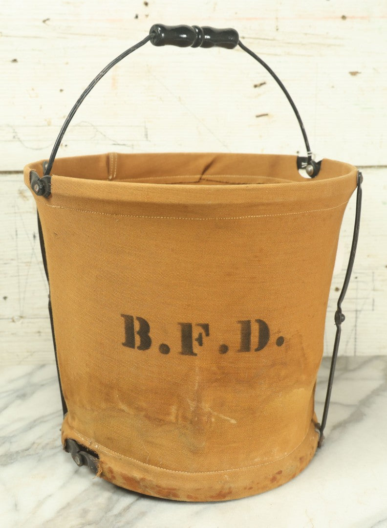 Lot 025 - Antique Brookfield Fire Department B.F.D. Canvas Folding Water Bucket, By Handy Folding Pail Co., Westfield, Massachusetts