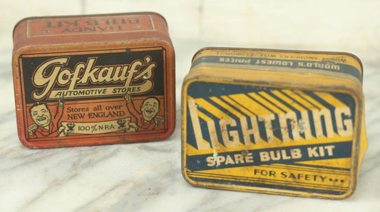 Lot 027 - Pair Of Vintage Automotive Light Bulb Tins With Contents Including Gofkauf's Automotive Stores Of New England, And Lighting Auto Stores Incorporated, As Found