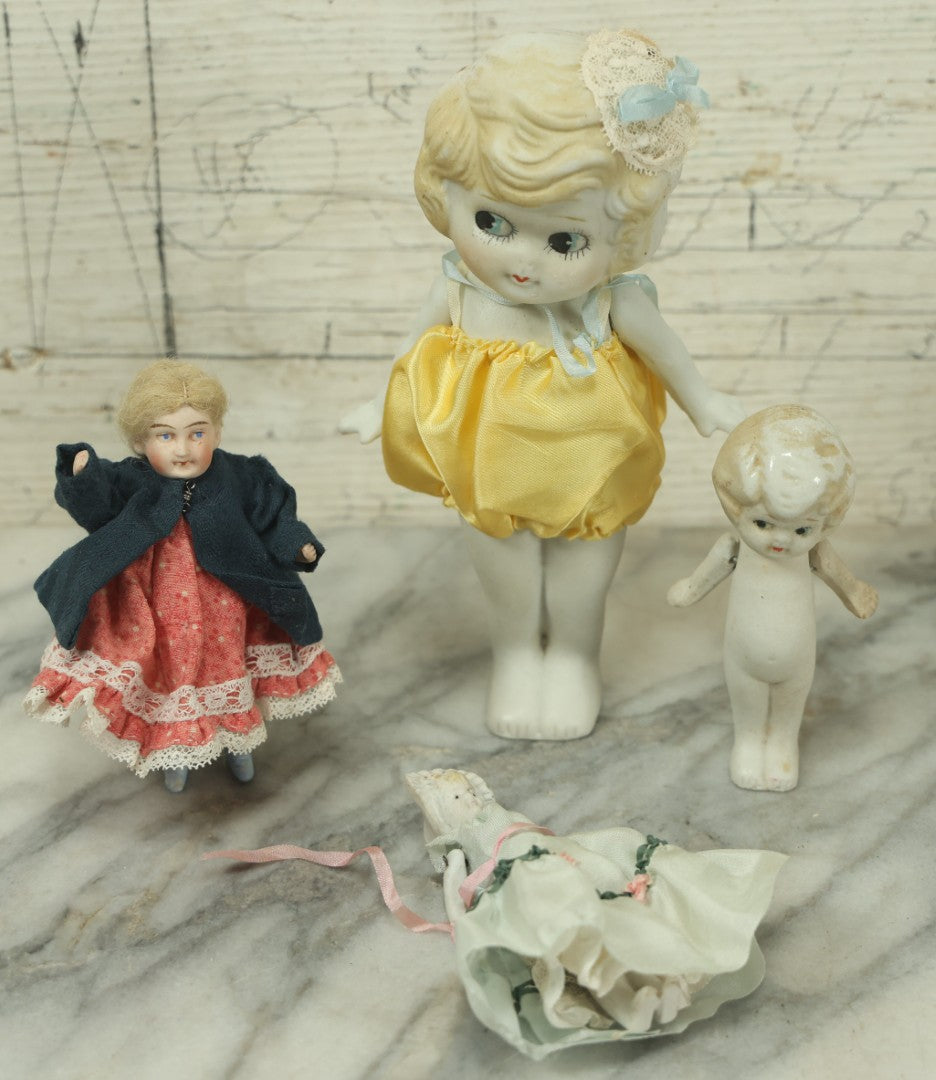 Lot 047 - Grouping Of Four Vintage And Antique Bisque Flapper Kewpie-Like And Other Dolls, Some Made In Japan