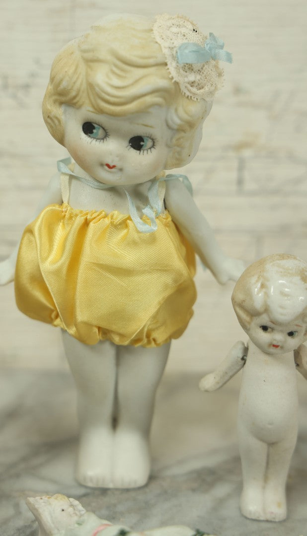 Lot 047 - Grouping Of Four Vintage And Antique Bisque Flapper Kewpie-Like And Other Dolls, Some Made In Japan