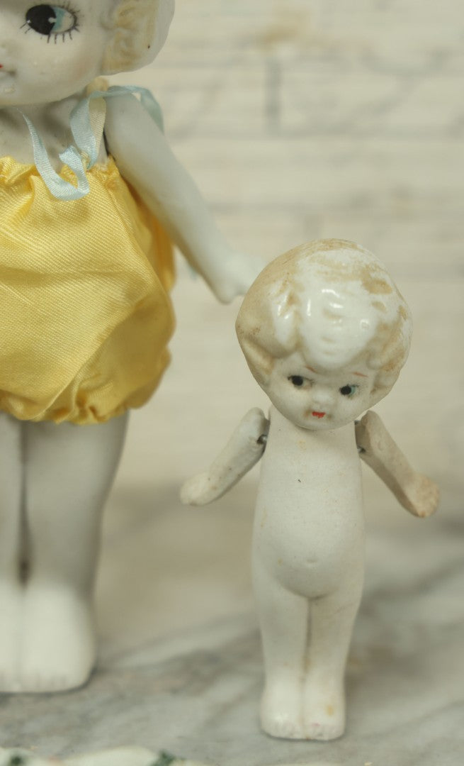 Lot 047 - Grouping Of Four Vintage And Antique Bisque Flapper Kewpie-Like And Other Dolls, Some Made In Japan