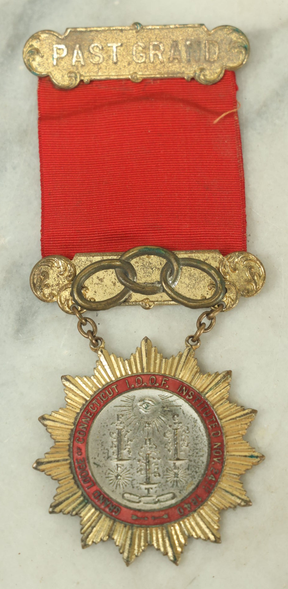 Lot 055 - Antique Independent Order Of Odd Fellows I.O.O.F. Past Grand Master Red Ribbon And Badge, Grand Lodge Of Connecticut, By Whitehead And Hoag Co., Newark, New Jersey