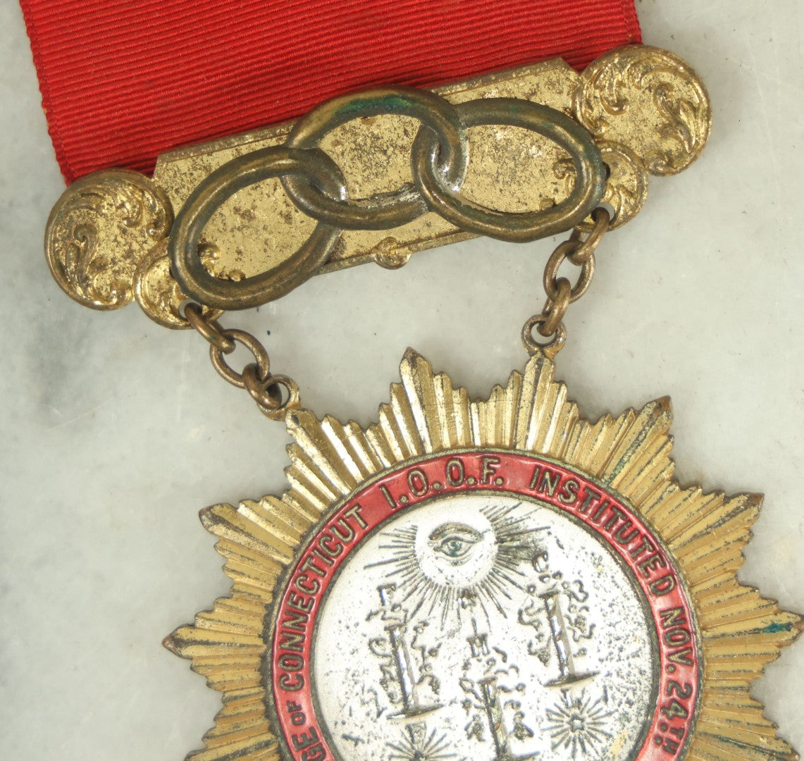 Lot 055 - Antique Independent Order Of Odd Fellows I.O.O.F. Past Grand Master Red Ribbon And Badge, Grand Lodge Of Connecticut, By Whitehead And Hoag Co., Newark, New Jersey