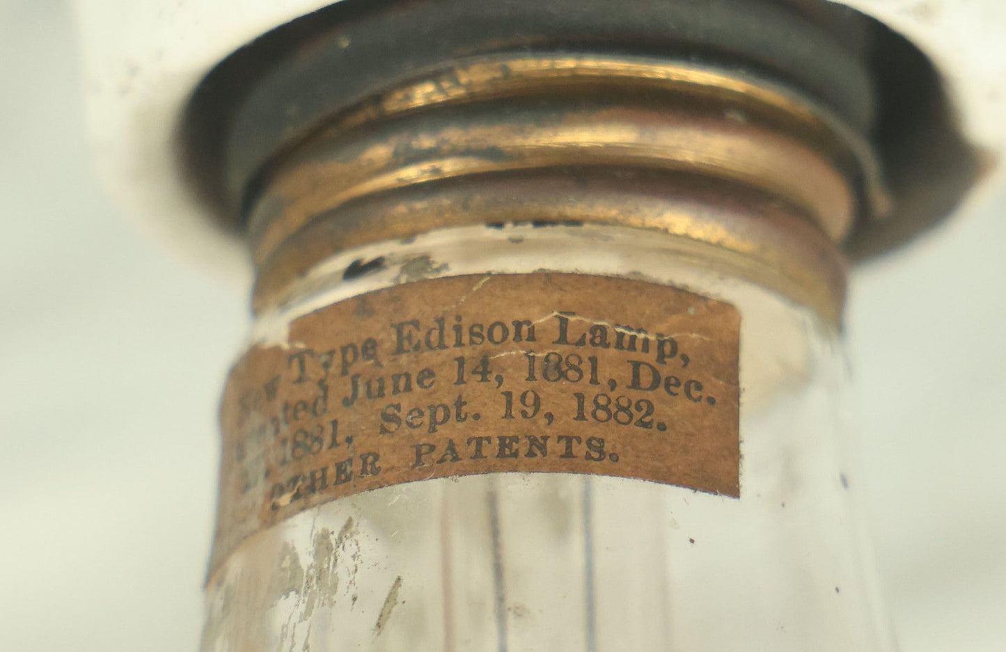 Lot 056 - Antique New Type Edison Lamp Light Bulb, Latest Patent Date September 1882, On Simple Porcelain Fixture, As Found, Untested, With Paper Label