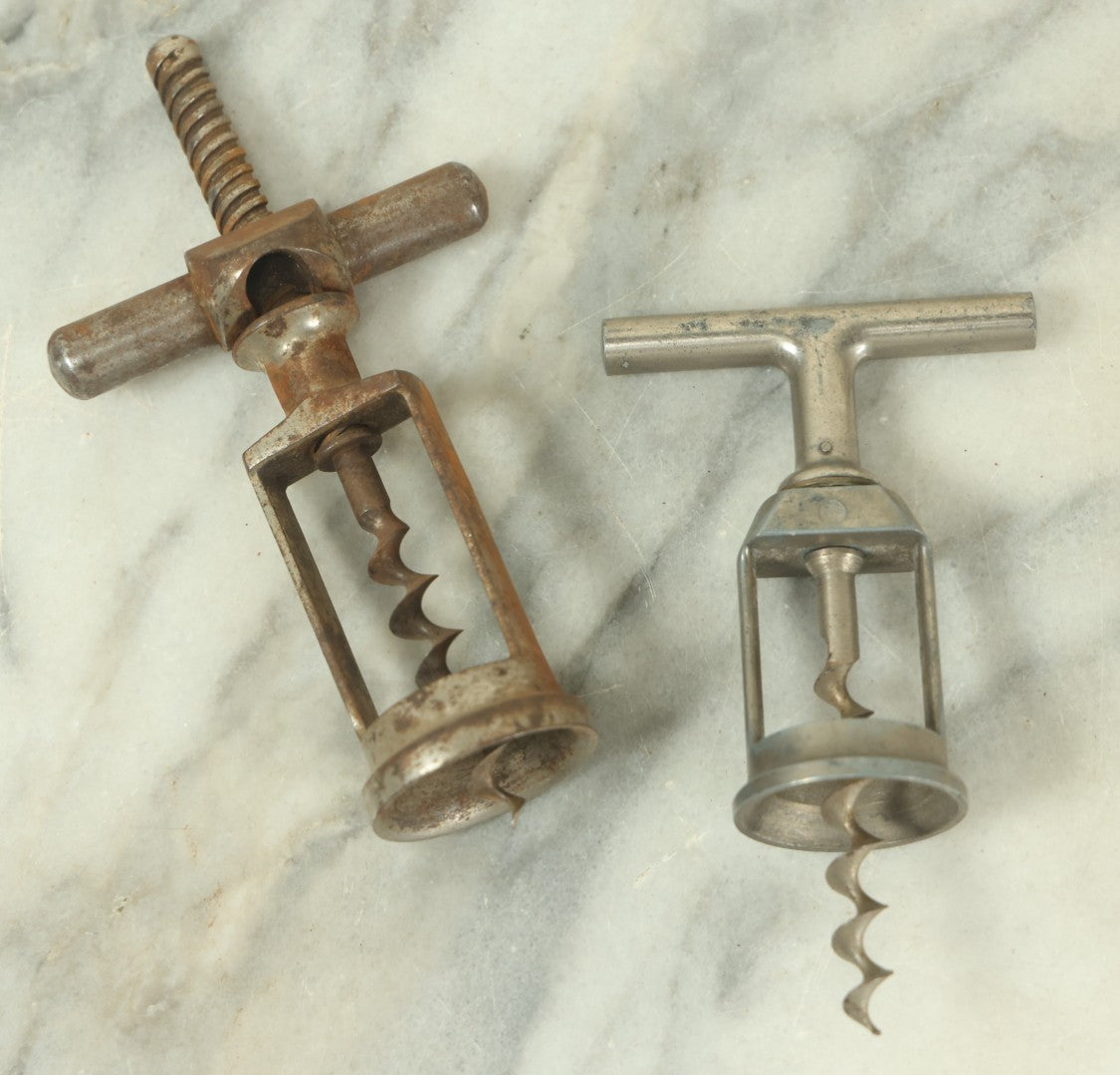 Lot 057 - Pair Of Antique Metal Wine Bottle Corkscrew Pullers