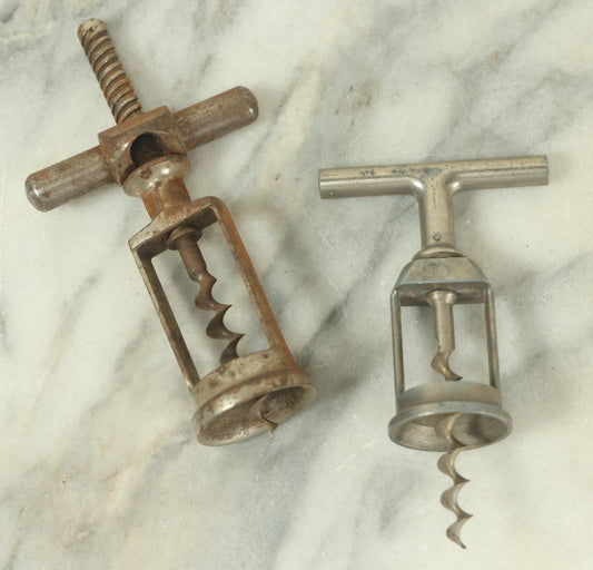 Lot 057 - Pair Of Antique Metal Wine Bottle Corkscrew Pullers