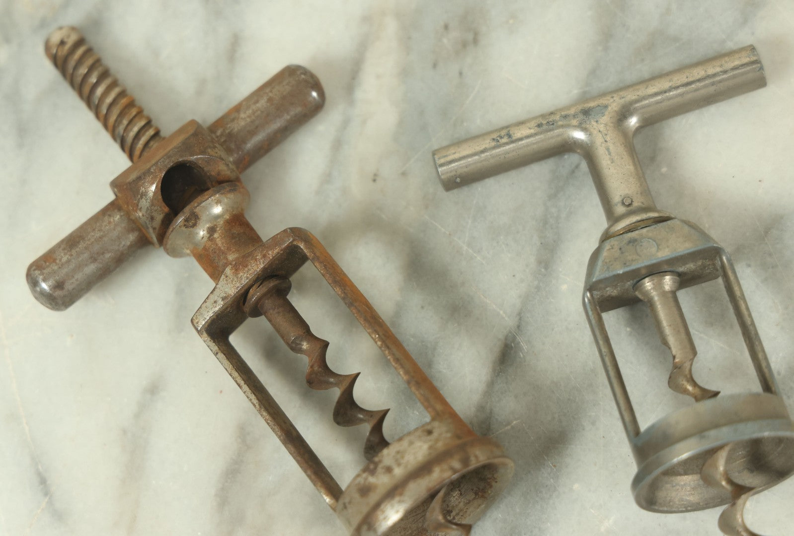 Lot 057 - Pair Of Antique Metal Wine Bottle Corkscrew Pullers