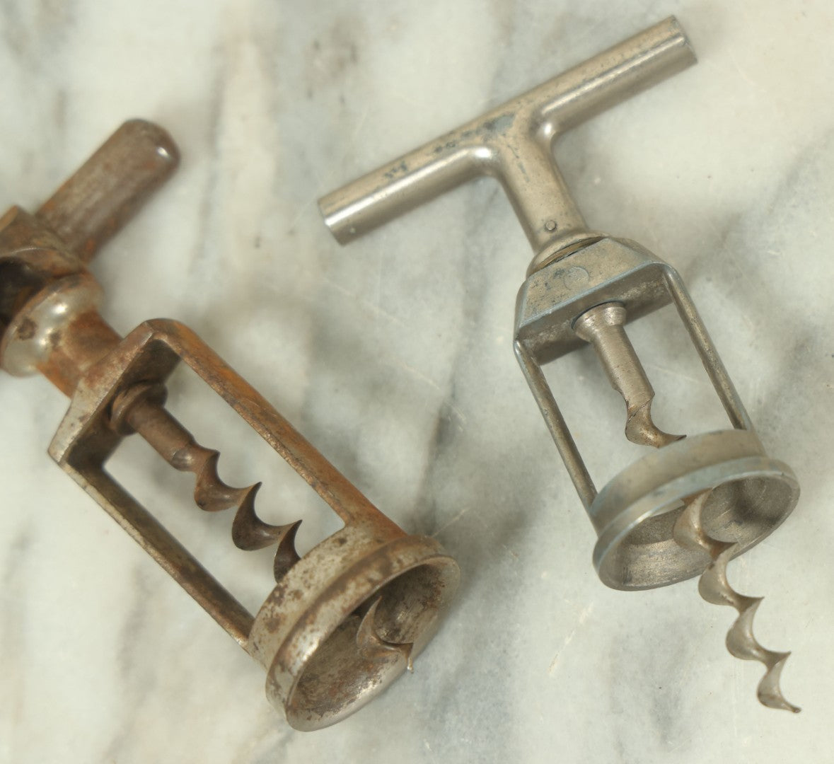 Lot 057 - Pair Of Antique Metal Wine Bottle Corkscrew Pullers