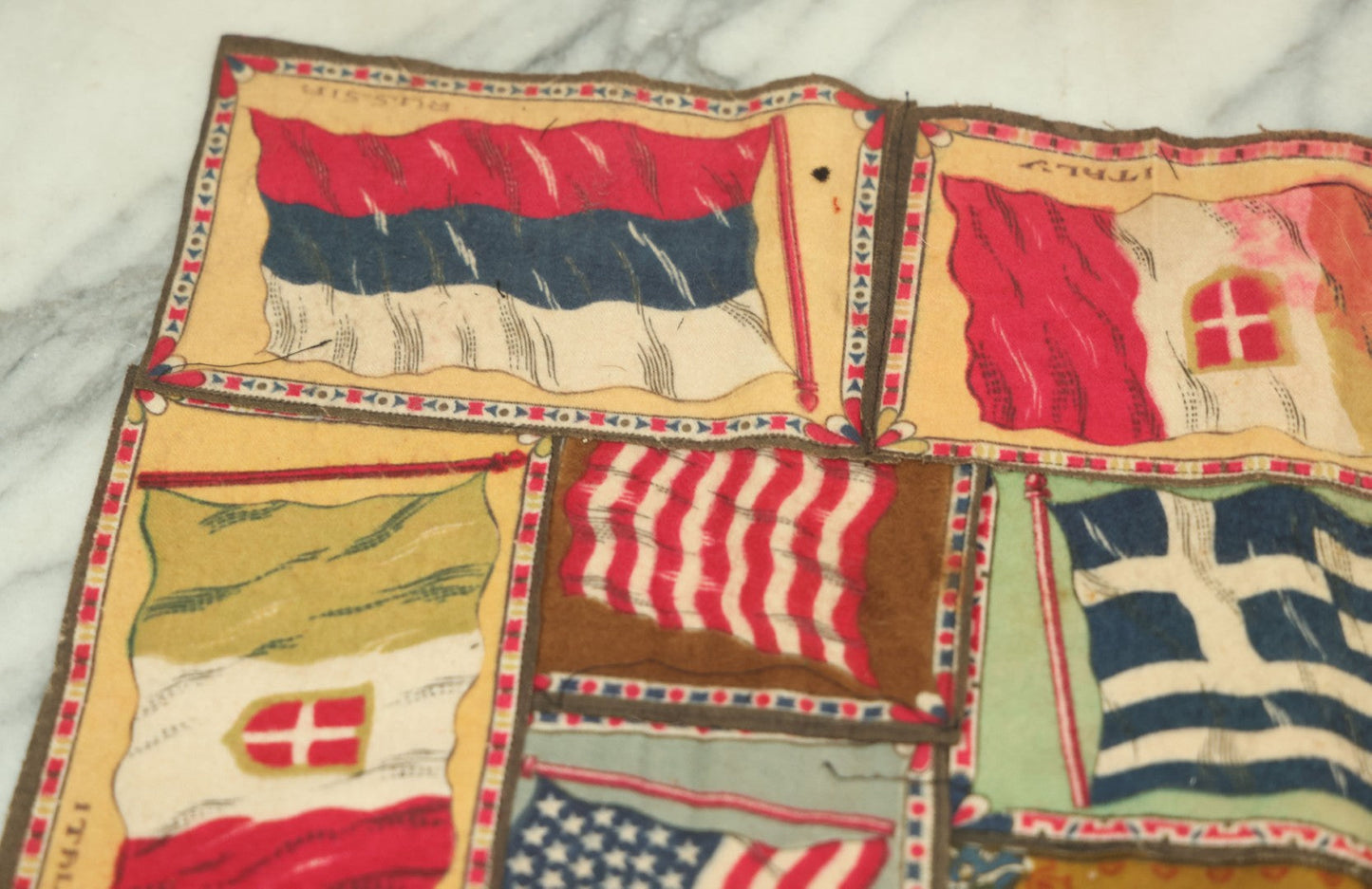 Lot 062 - Antique Tobacco Felt Sewn Quilt With Flags From Many Countries Including The United States, Austria Hungary, Poland, Italy, France, Russie, Etc, As Found