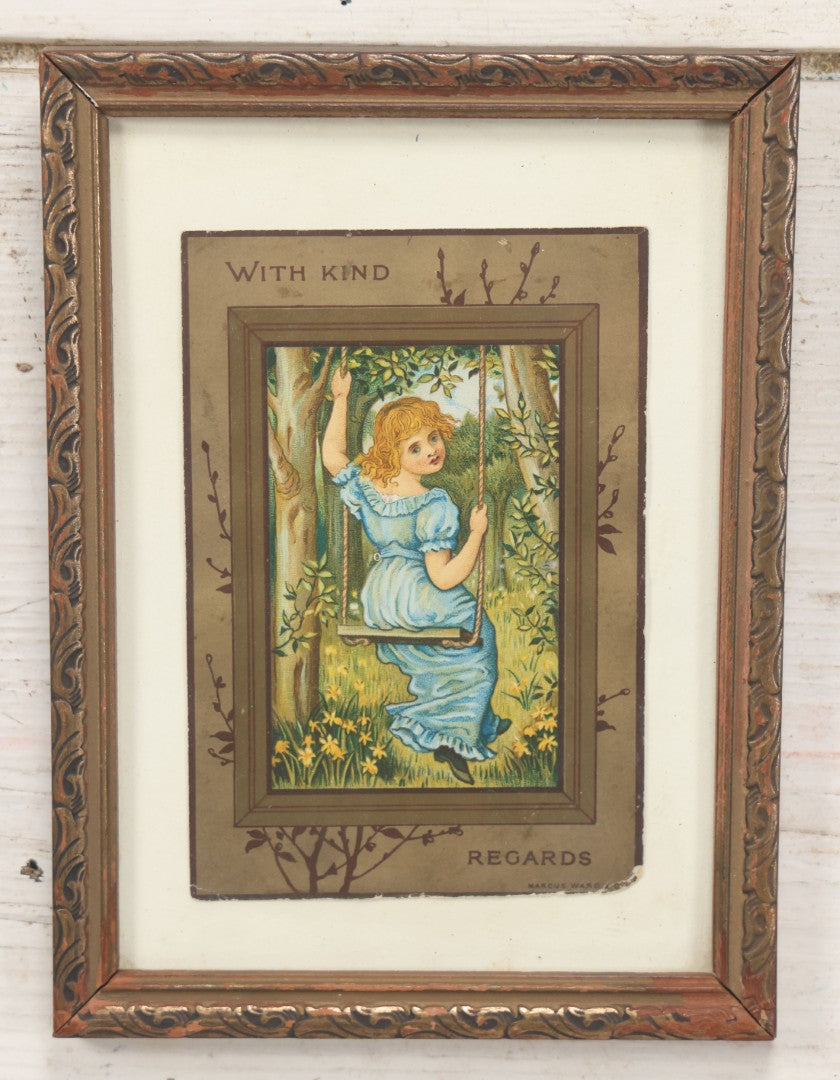 Lot 057 - Antique Framed Postcard Of A Little Girl In Blue On A Swing "With Kind Regards," By Marcus Ward & Co., 5-3/4" x 7-3/4"