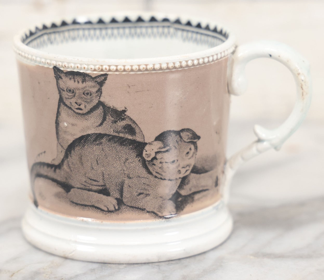Lot 059 - Antique Transferware Ceramic Mug With Cats And Dogs, Geometric Pattern On Interior