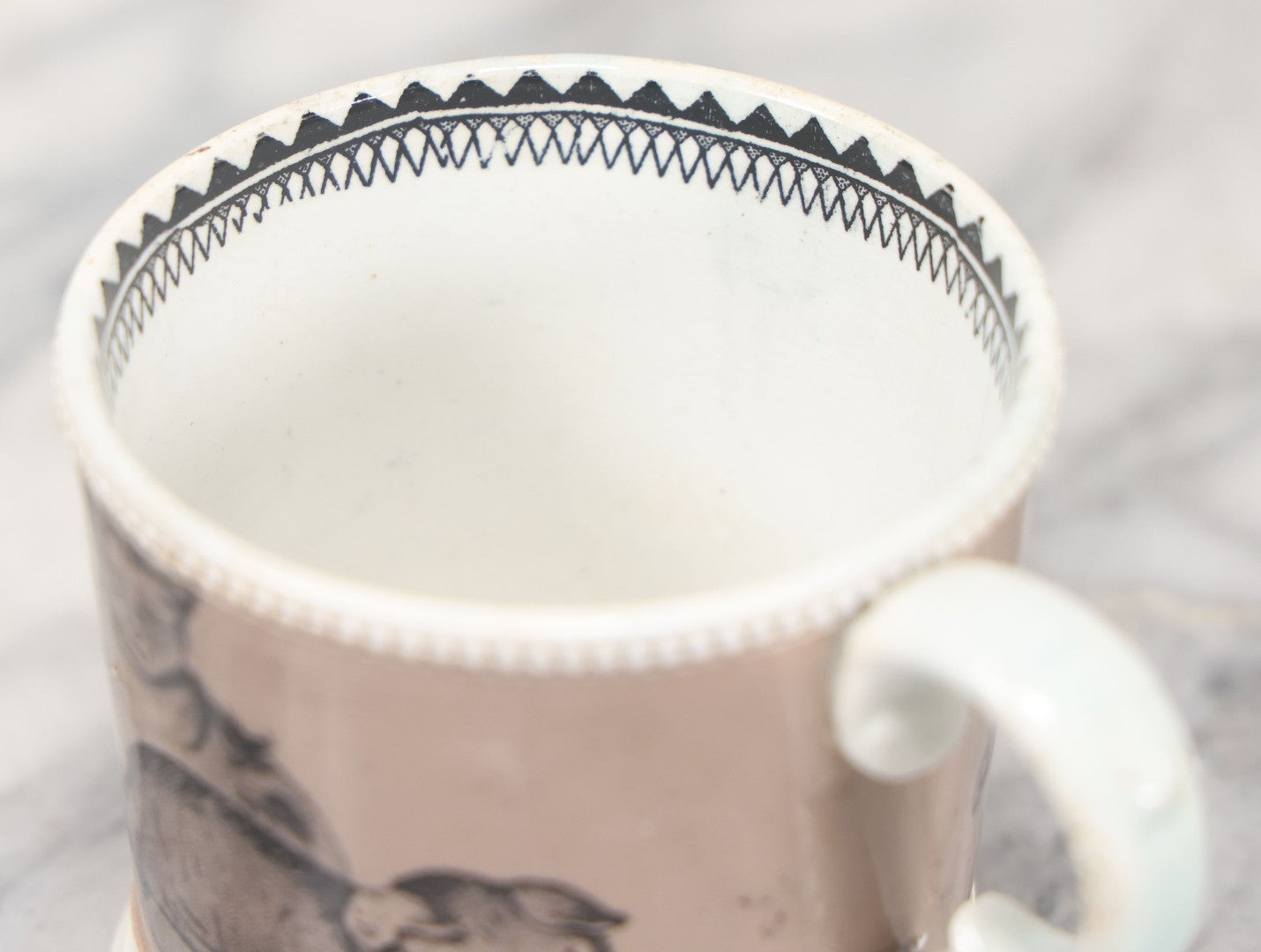 Lot 059 - Antique Transferware Ceramic Mug With Cats And Dogs, Geometric Pattern On Interior
