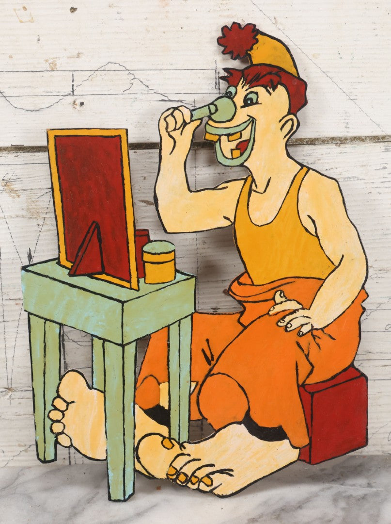 Lot 067 - Vintage Folk Art, Scroll Cut Hand Painted Clown With Large Feet Doing Makeup In Mirror, Grinning With Yellow Teeth 