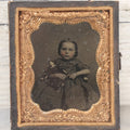 Lot 102 - Antique 1/6th Plate Cased Tintype Photograph Of A Little Girl Holding Her Doll, Half Leatherette Case
