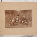 Lot 106 - Antique Boarded Photo Of Three Young Men Hunting With Rifles, With Hunting Dog In Photo, Sitting On Ground, Identified