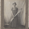 Lot 108 - Antique Boarded Photo Of A Young Woman In A Crown Holding A Silvery Foil Covered Paddle, Unknown Occasion