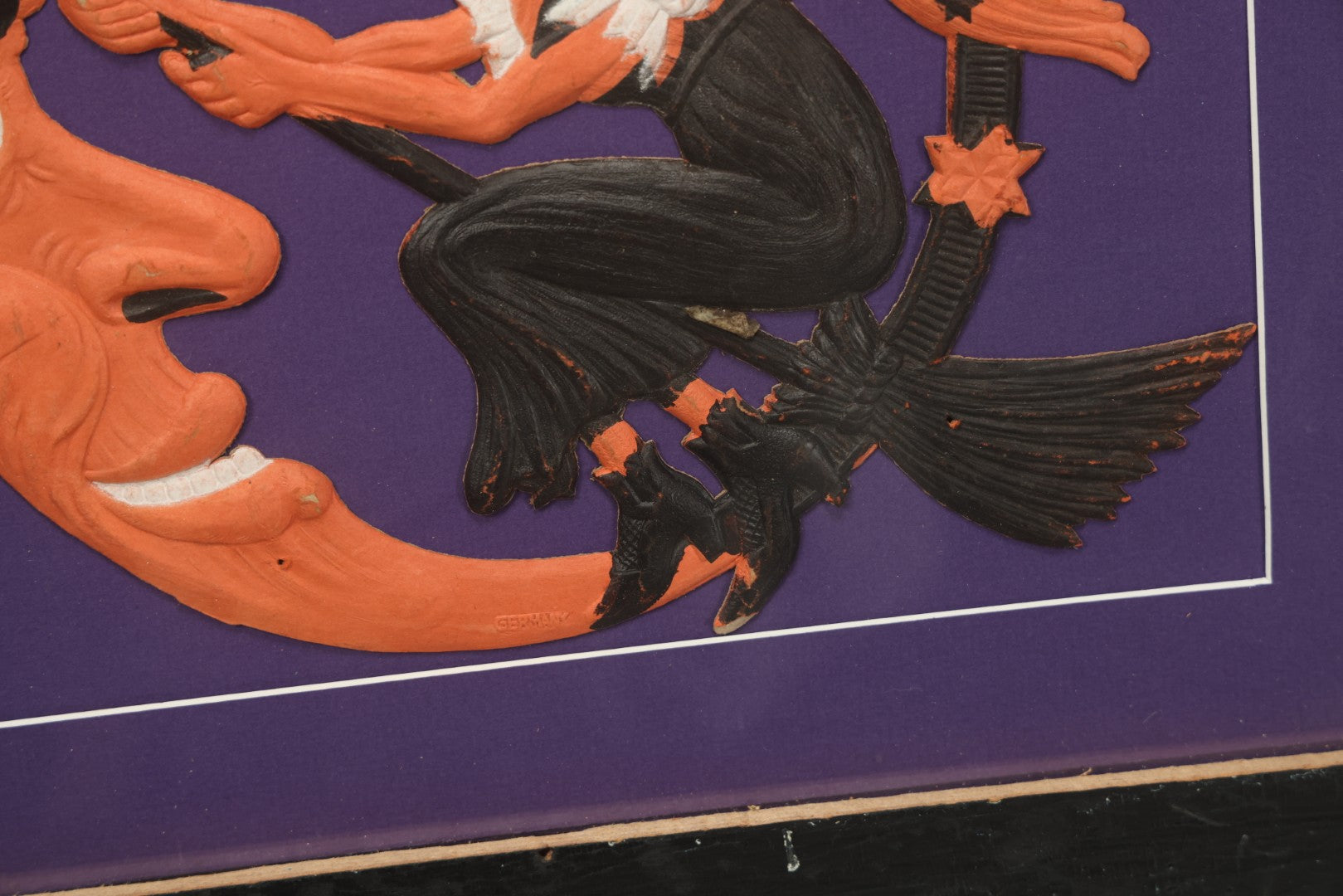 Lot 010 - Antique Witch On Broom With Moon Man Embossed Cardboard Paper Halloween Decoration, Made In Germany, In Custom Frame, 16-3/8" x 15-3/8"