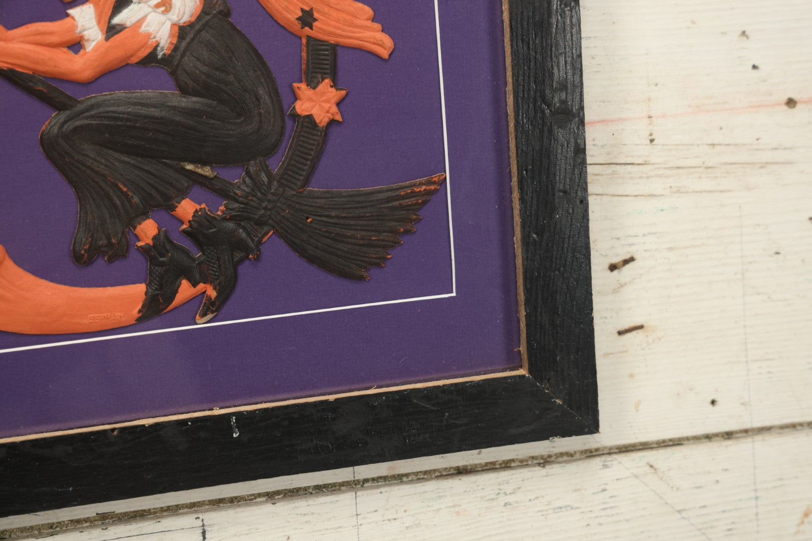 Lot 010 - Antique Witch On Broom With Moon Man Embossed Cardboard Paper Halloween Decoration, Made In Germany, In Custom Frame, 16-3/8" x 15-3/8"