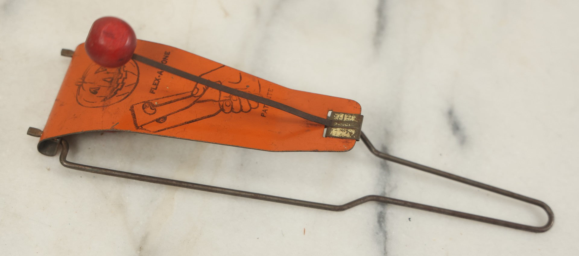 Lot 016 - Vintage Flex-A-Tone Tin Halloween Noise Maker With Pumpkin Jack-O-Lantern J.O.L., Marked Patente