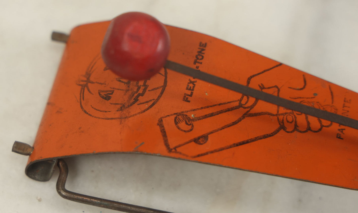 Lot 016 - Vintage Flex-A-Tone Tin Halloween Noise Maker With Pumpkin Jack-O-Lantern J.O.L., Marked Patente