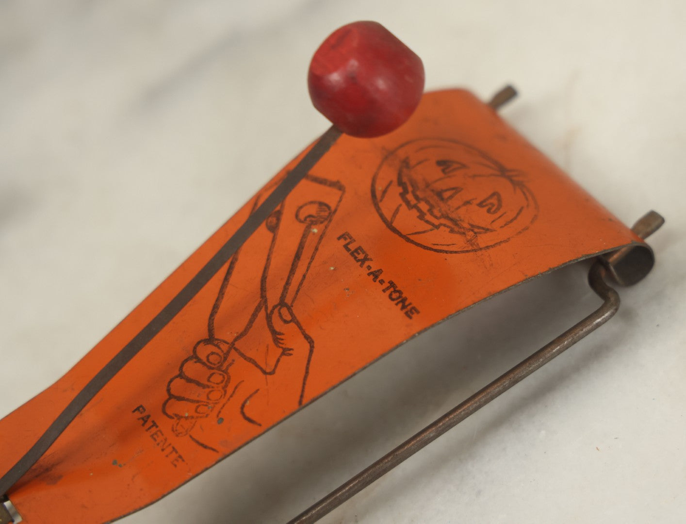 Lot 016 - Vintage Flex-A-Tone Tin Halloween Noise Maker With Pumpkin Jack-O-Lantern J.O.L., Marked Patente