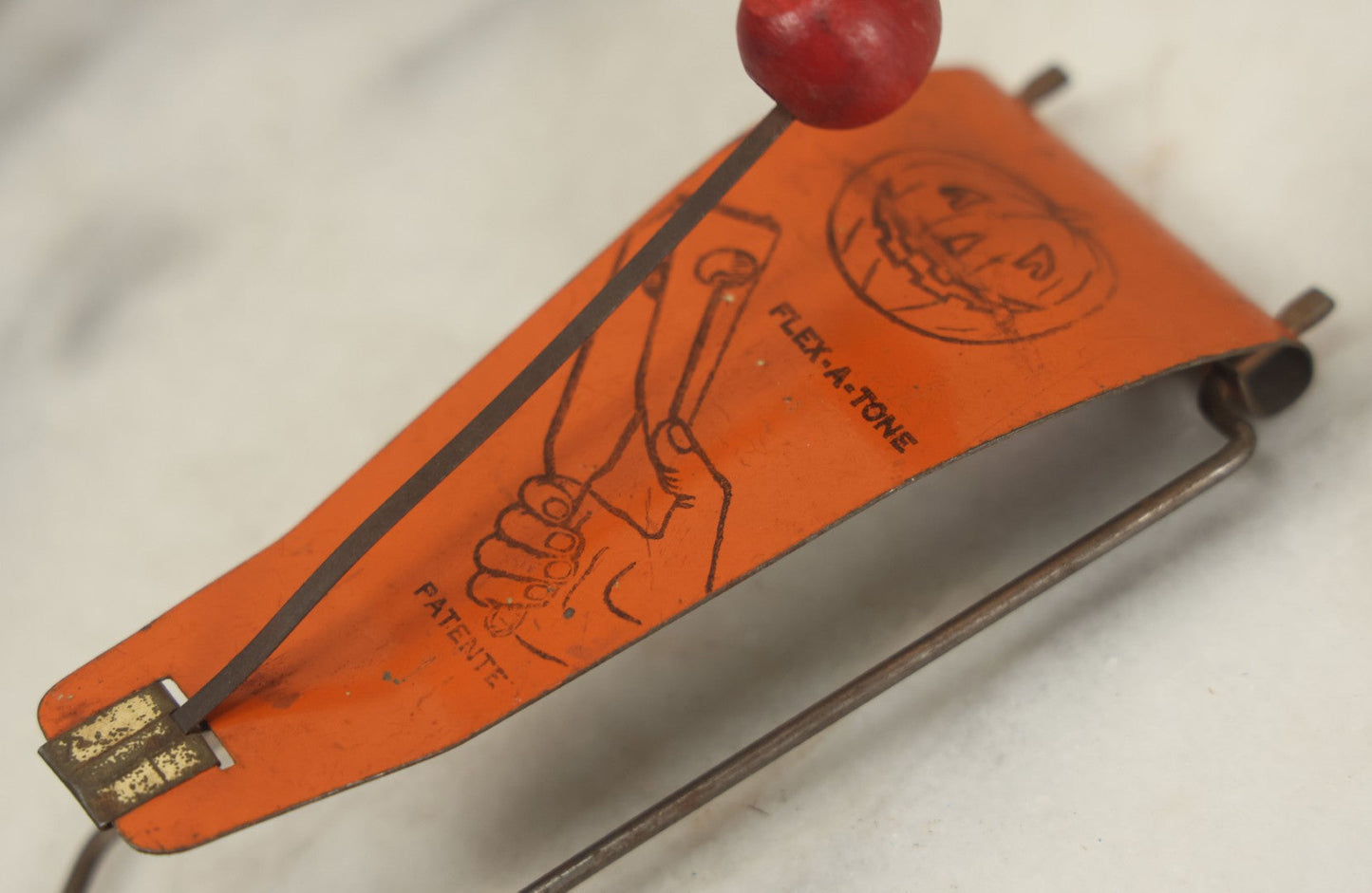 Lot 016 - Vintage Flex-A-Tone Tin Halloween Noise Maker With Pumpkin Jack-O-Lantern J.O.L., Marked Patente