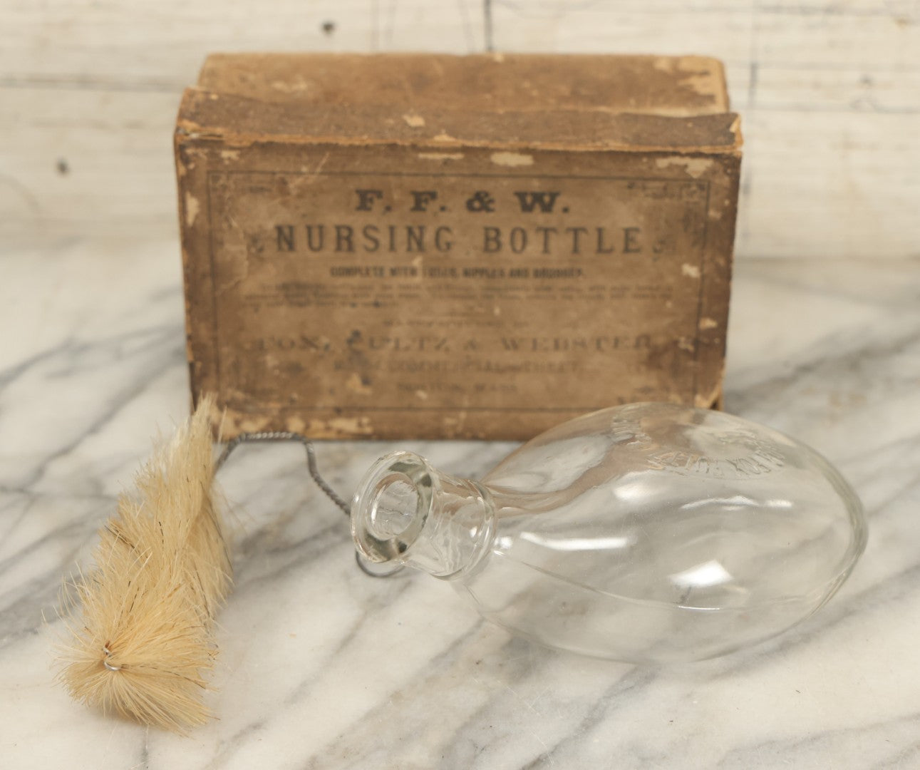 Lot 026 - Antique F.F. & W. Nursing Bottle, So-Called "Murder Bottle," In Original Box With Original Brush, Fox, Fultz, & Webster, Boston, Note Wear To Box, Chip To Bottle