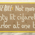 Lot 031 - Vintage Hand Painted Pool Hall Sign On Press Board, "House Rule: Not More Than 20 Lit Cigarettes," Note Corner Losses, Wear, Wrapped With Backing Board, 24-1/4" x 11-1/4"