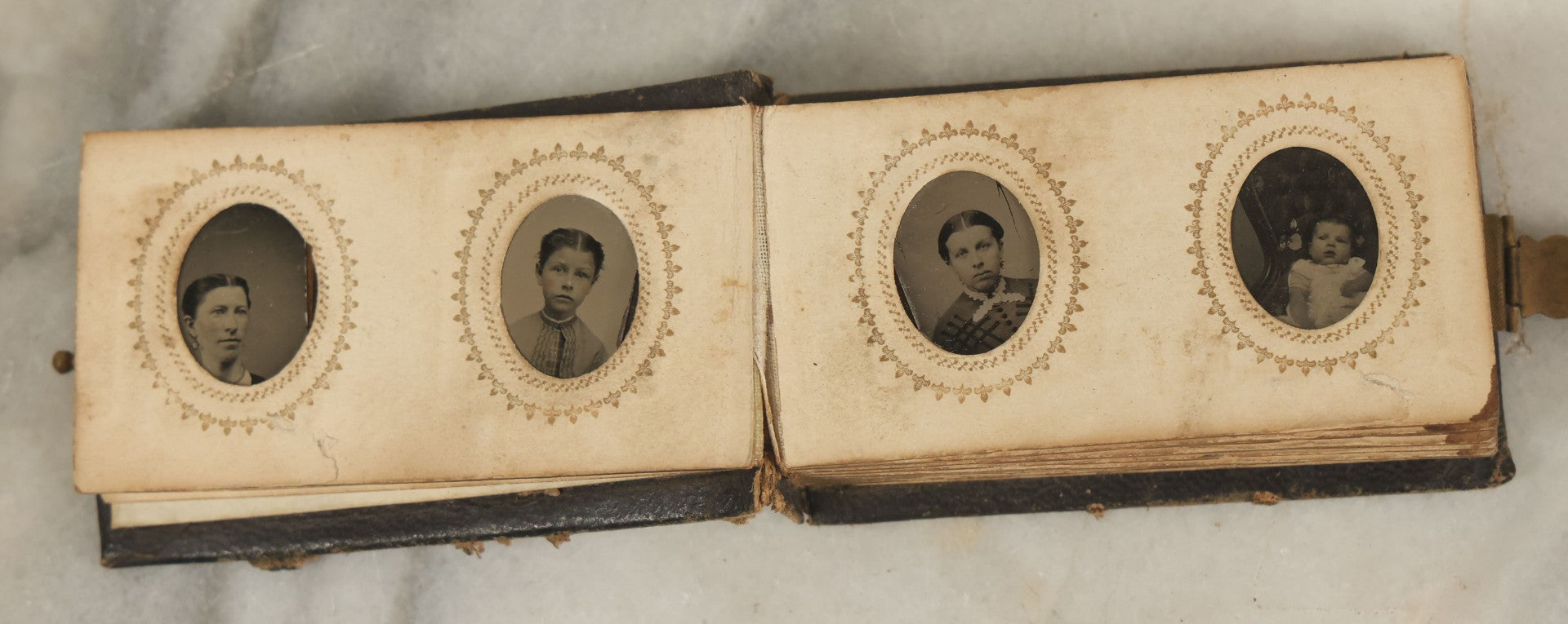 Lot 051 - Antique Gem Tintype Album With 46 Tintype Photographs Of Men, Women, And Children, Including Two "Not-So-Hidden" Mother Photographs