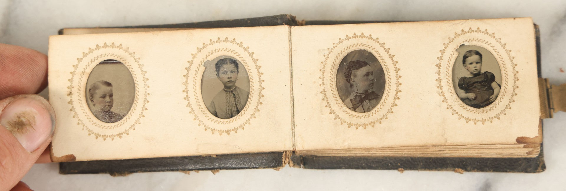 Lot 051 - Antique Gem Tintype Album With 46 Tintype Photographs Of Men, Women, And Children, Including Two "Not-So-Hidden" Mother Photographs