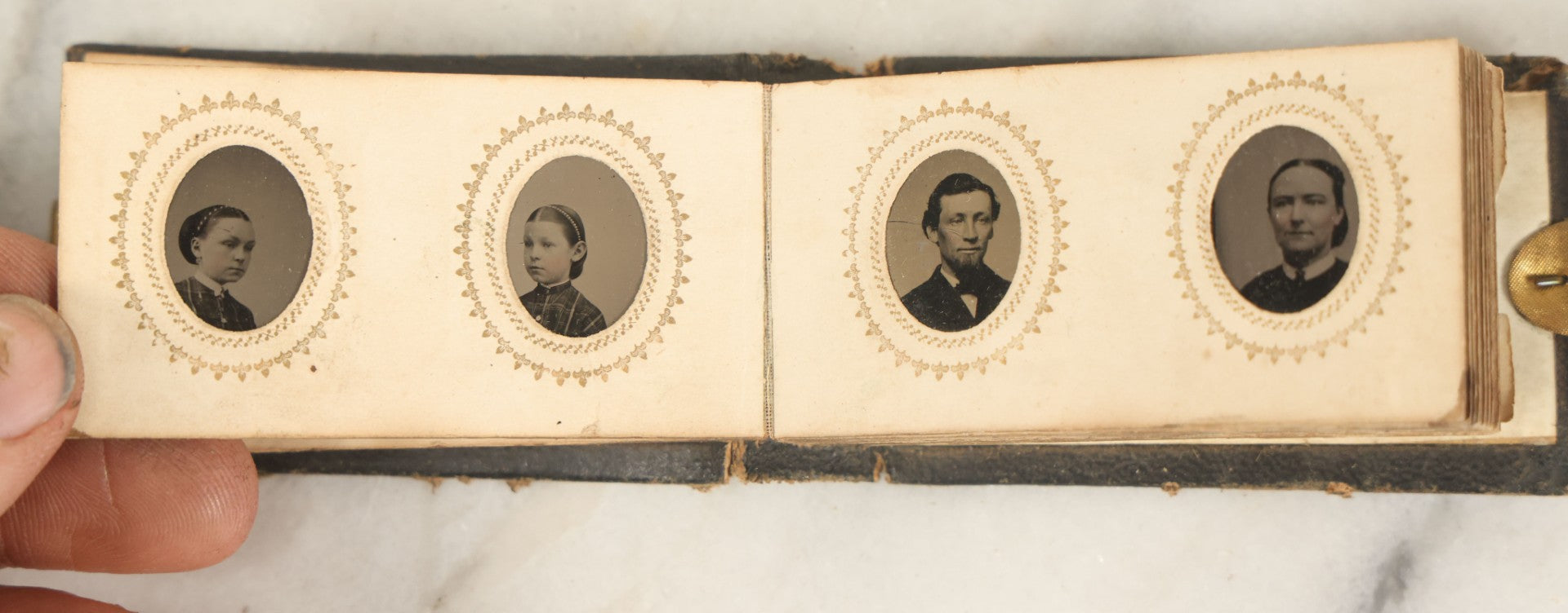 Lot 051 - Antique Gem Tintype Album With 46 Tintype Photographs Of Men, Women, And Children, Including Two "Not-So-Hidden" Mother Photographs