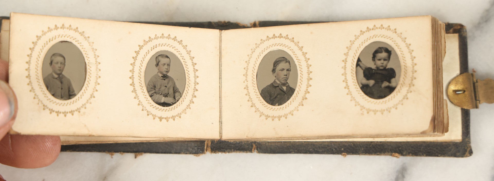 Lot 051 - Antique Gem Tintype Album With 46 Tintype Photographs Of Men, Women, And Children, Including Two "Not-So-Hidden" Mother Photographs