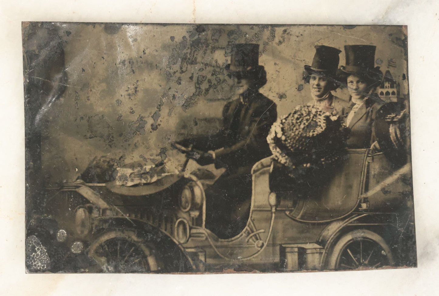 Lot 056 - Single Antique Tintype Photograph, Three Women In Top Hats Driving In Early Automobile, Smiling
