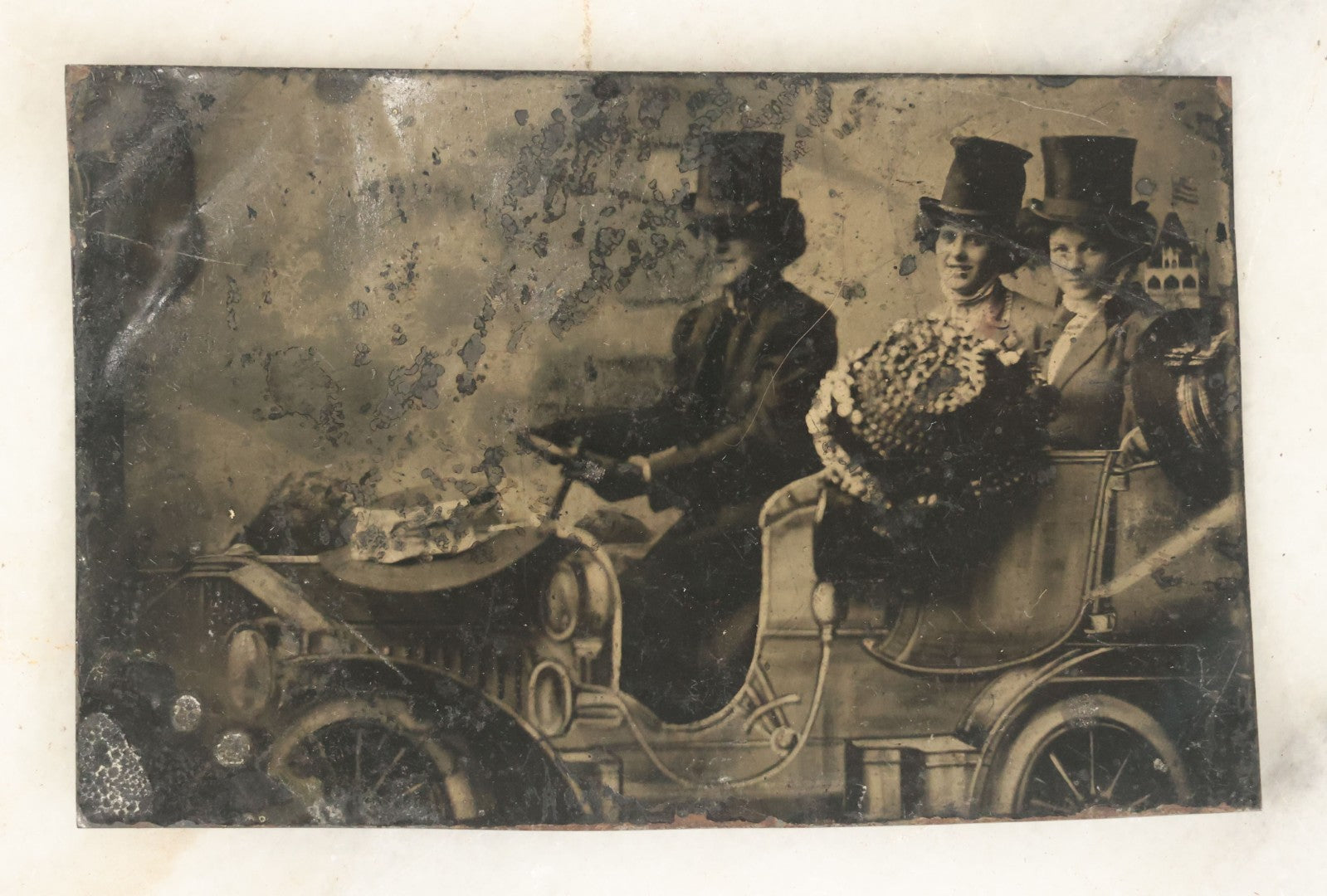 Lot 056 - Single Antique Tintype Photograph, Three Women In Top Hats Driving In Early Automobile, Smiling
