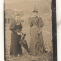 Lot 059 - Single Antique Tintype Photograph, Two Women Outdoors In Town Square, With Parasols