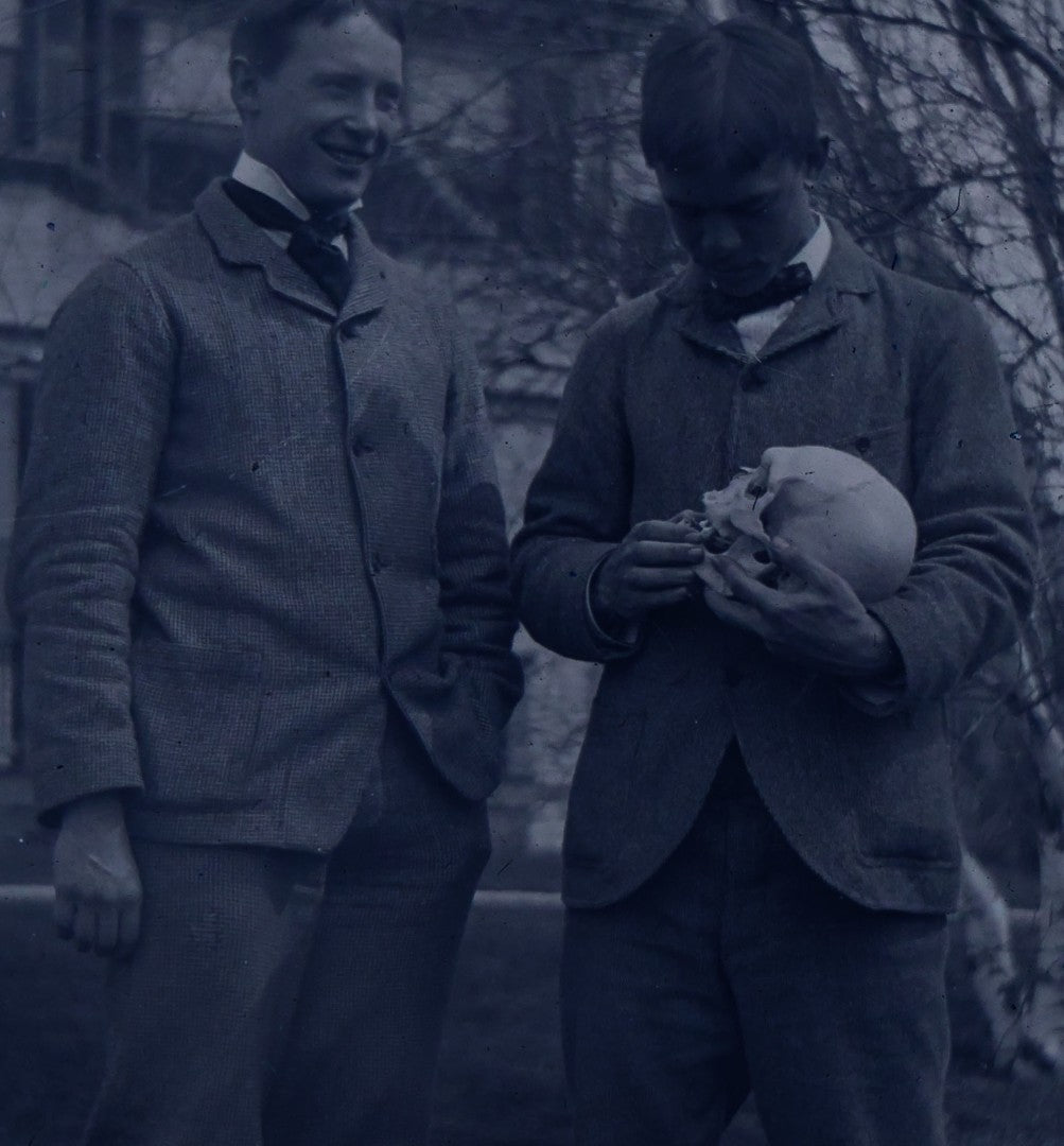 Lot 061 - Single Antique Glass Negative Plate, Man Holding Real Human Skull, With Grinning Man To Left, In Front Of House, Note Edge Cracks (First Photo Is Inverted)