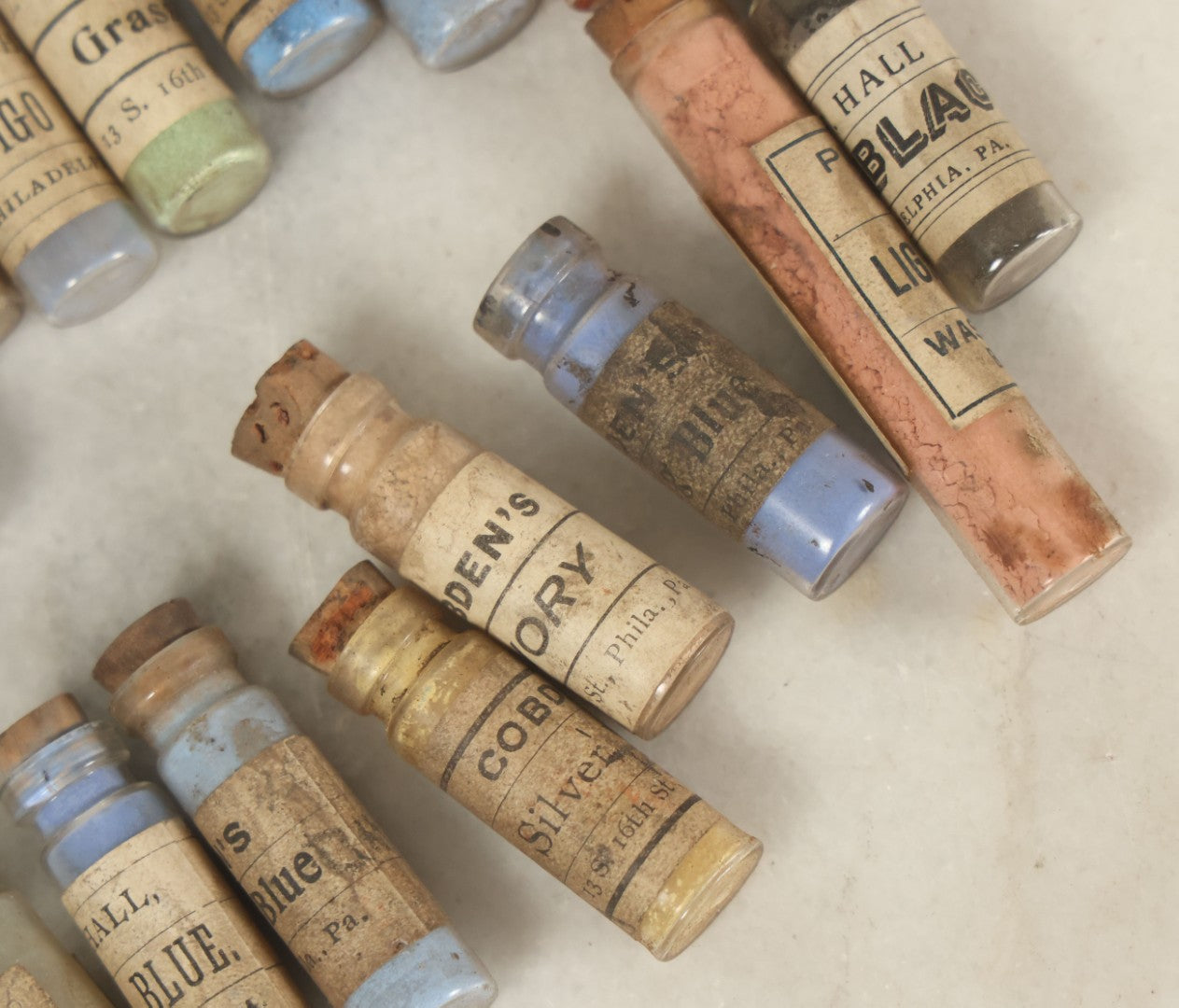 Lot 074 - Grouping Of 20+ Antique Glass Vial Bottles Of Various Paints And Pigments, Powders, By Various Manufacturers, As Found, With Paper Labels
