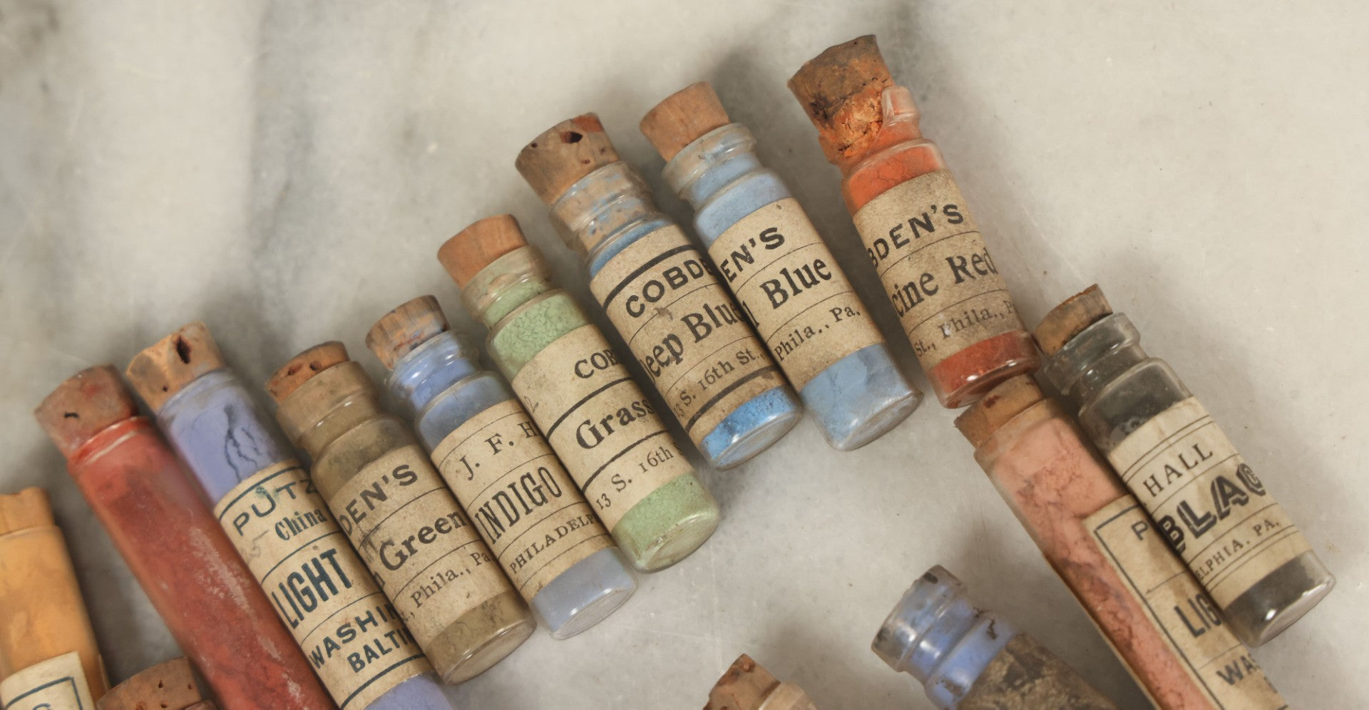 Lot 074 - Grouping Of 20+ Antique Glass Vial Bottles Of Various Paints And Pigments, Powders, By Various Manufacturers, As Found, With Paper Labels