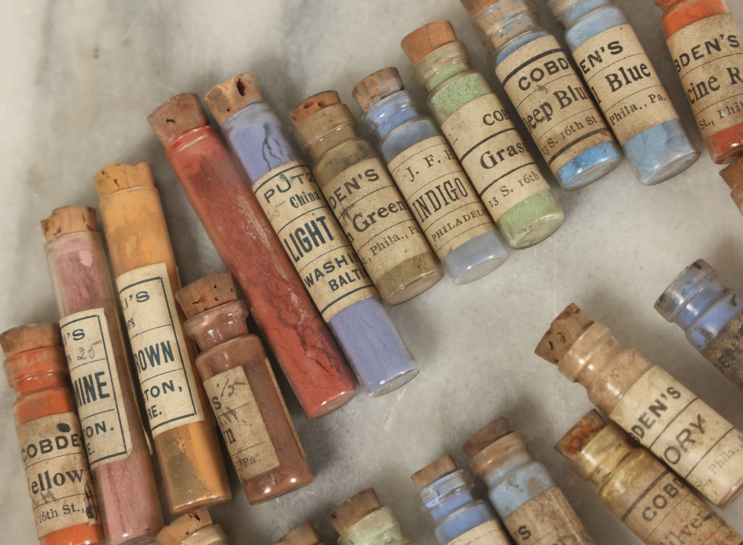 Lot 074 - Grouping Of 20+ Antique Glass Vial Bottles Of Various Paints And Pigments, Powders, By Various Manufacturers, As Found, With Paper Labels