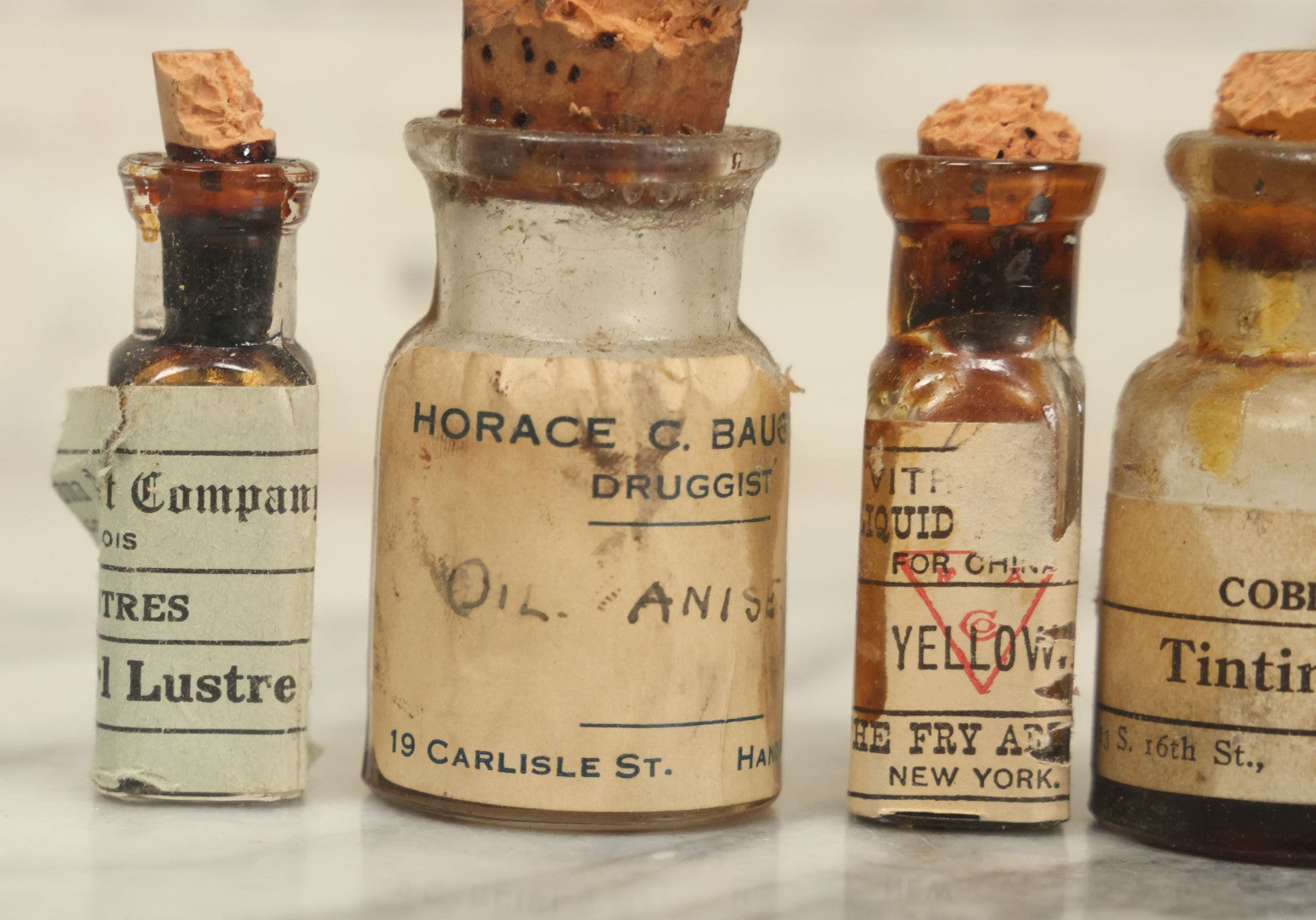 Lot 075 - Grouping Of 7 Antique Glass Bottles For Artists Supplies, Including Tinting Oil, Oil Anise, Lustre, And Others, As Found, Various Manufacturers