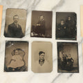 Lot 094 - Grouping Of Ten Tintypes Of Men, Women, And Children, Including Old Man With Beard, Man With Watch Chain, Boy Standing At Table, Others, Four With Paper Frames