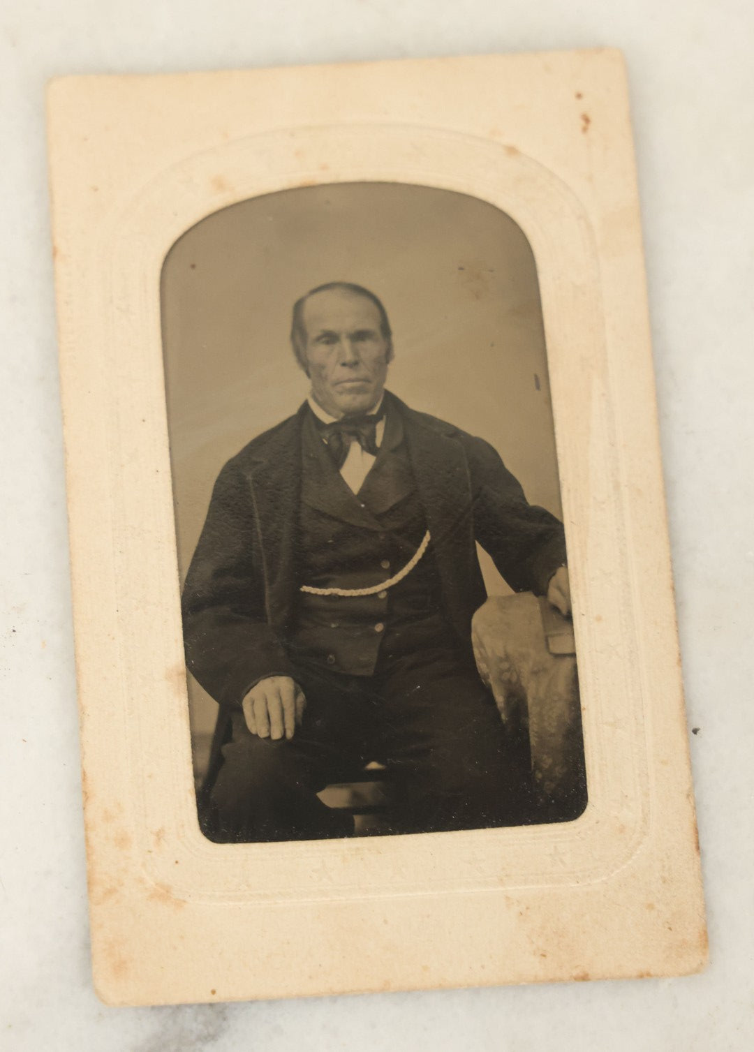 Lot 094 - Grouping Of Ten Tintypes Of Men, Women, And Children, Including Old Man With Beard, Man With Watch Chain, Boy Standing At Table, Others, Four With Paper Frames