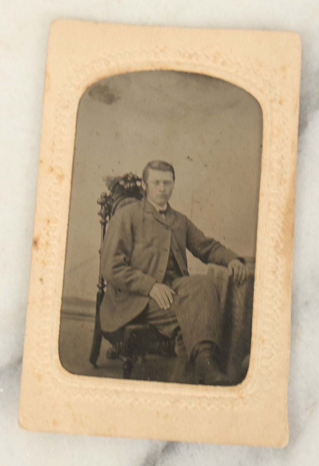 Lot 094 - Grouping Of Ten Tintypes Of Men, Women, And Children, Including Old Man With Beard, Man With Watch Chain, Boy Standing At Table, Others, Four With Paper Frames